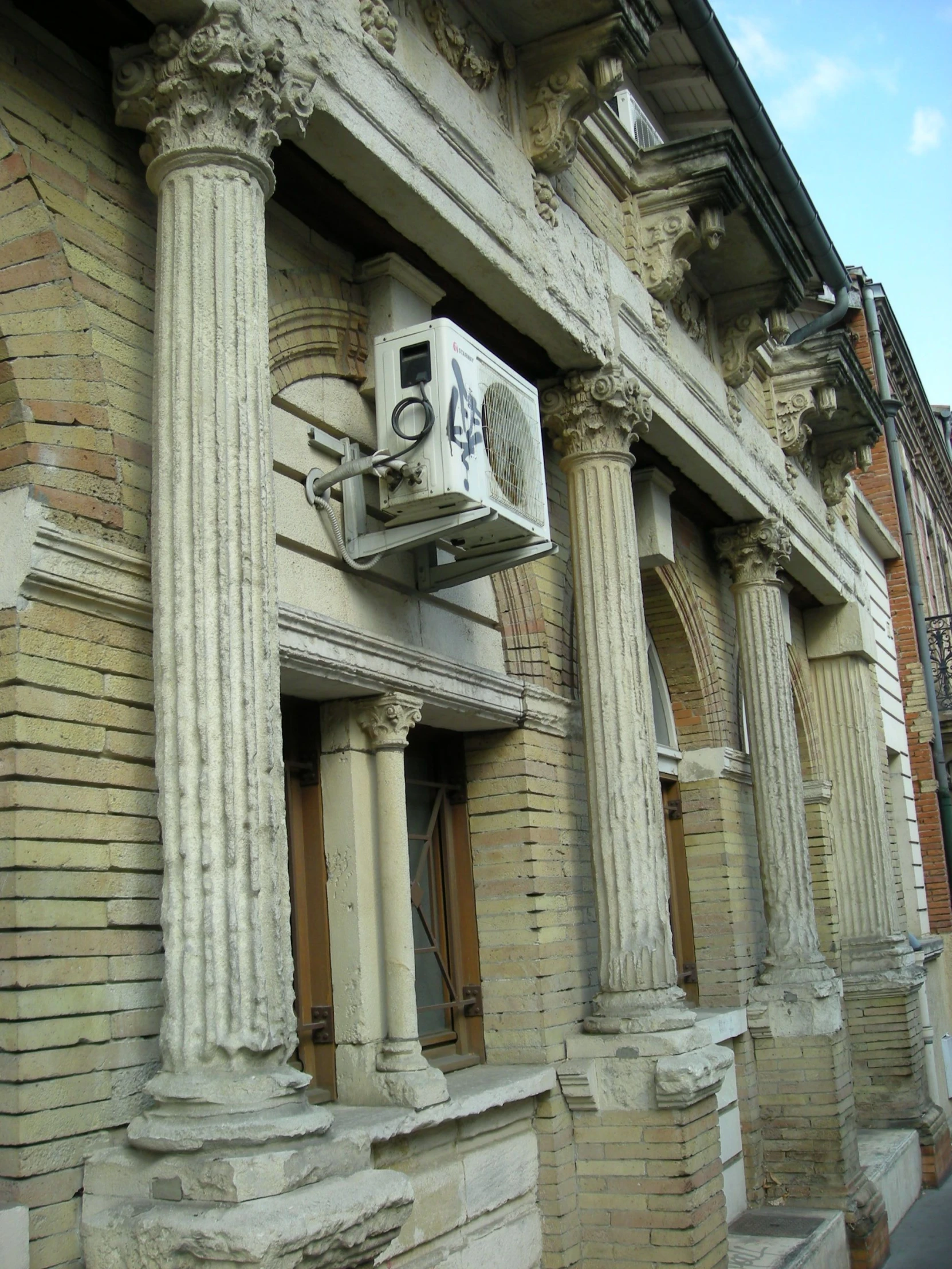 a clock on the side of an old building