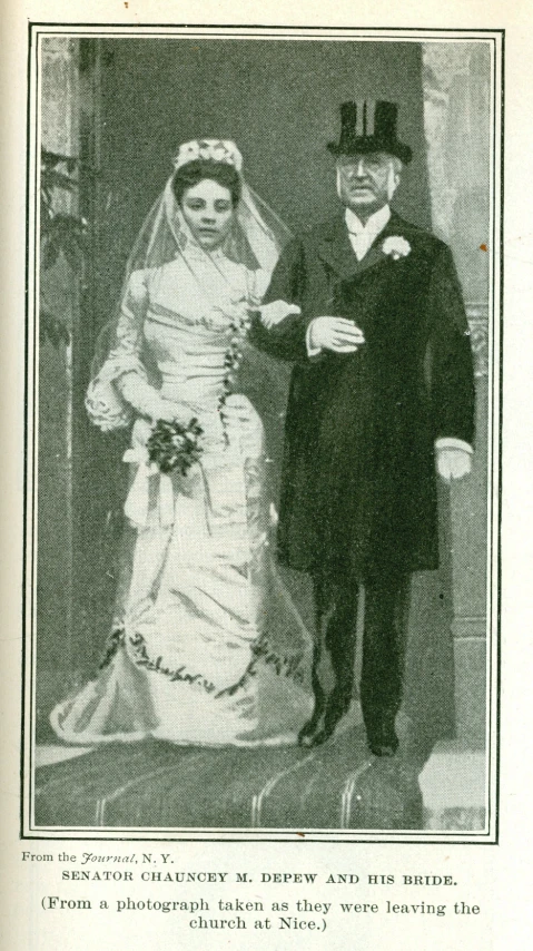 a man and woman in formal wear posing together