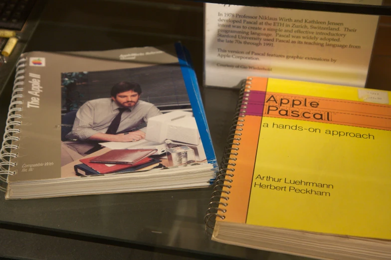 books and flyers for apple passacl are displayed