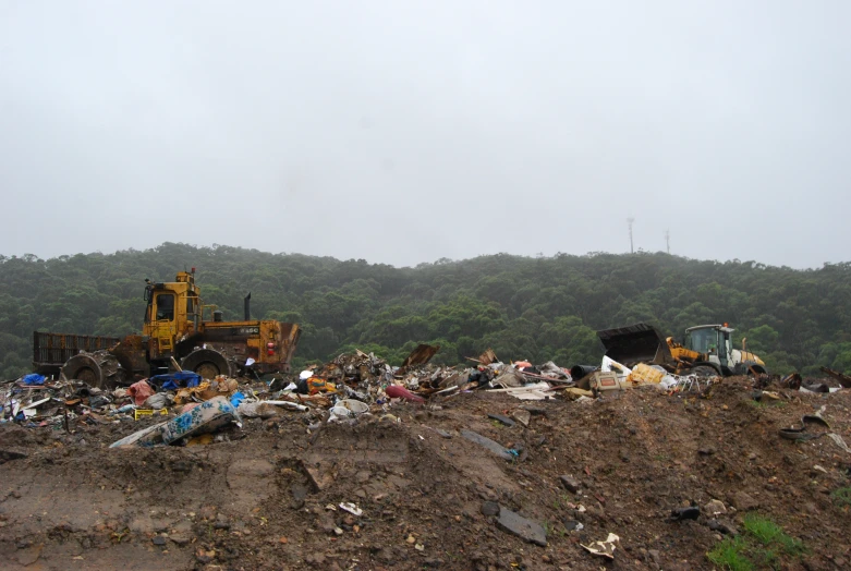 garbage pile near a tractor and construction equipment