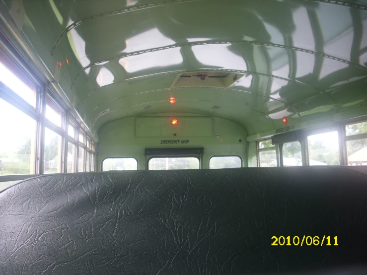 the interior of an old bus with some windows