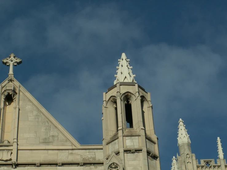 an old building with spires and a cross