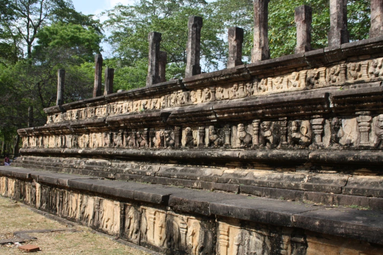 this building is surrounded by many carved faces