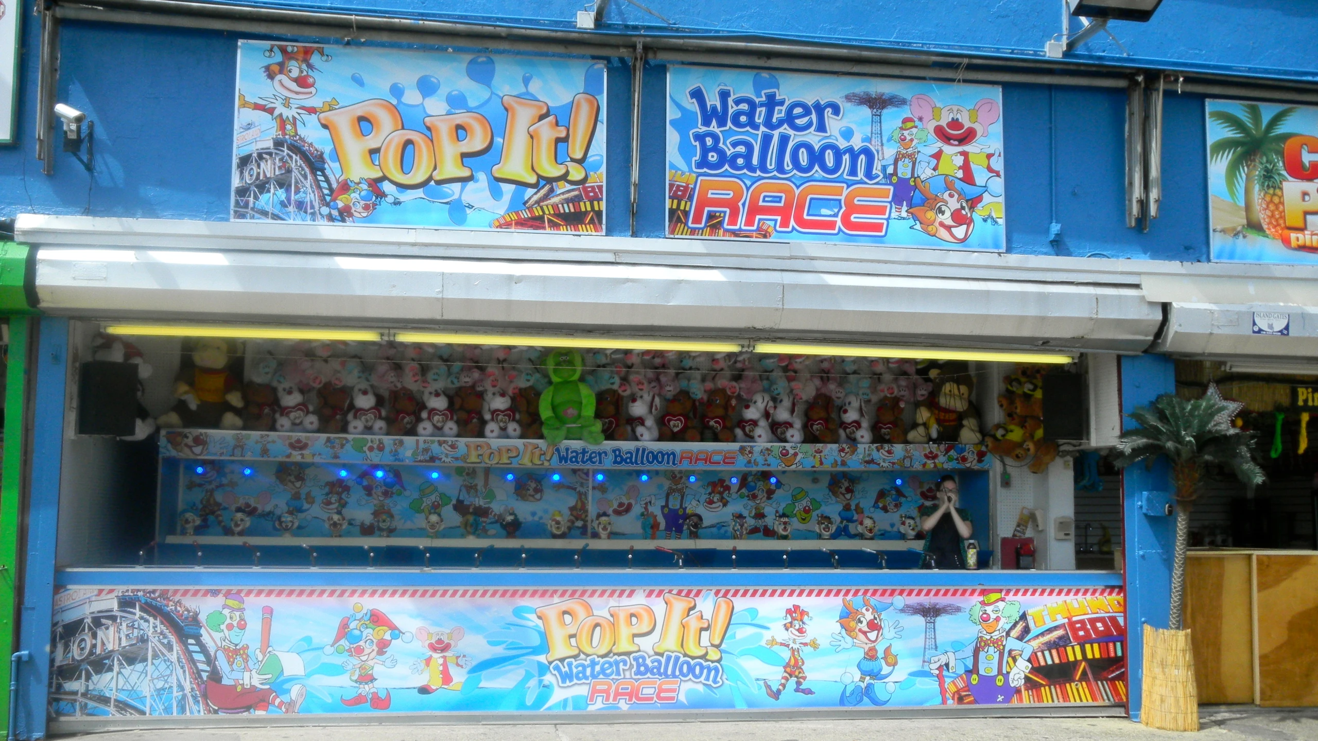 a colorful store front with posters on it