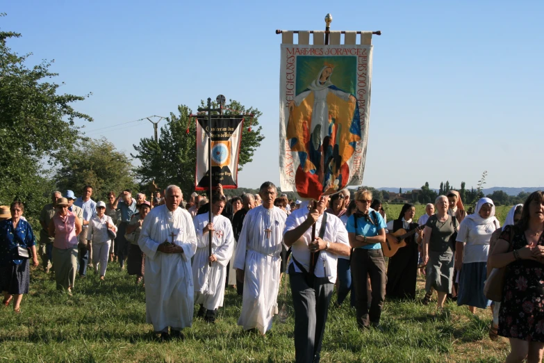 a group of people in robes standing next to each other