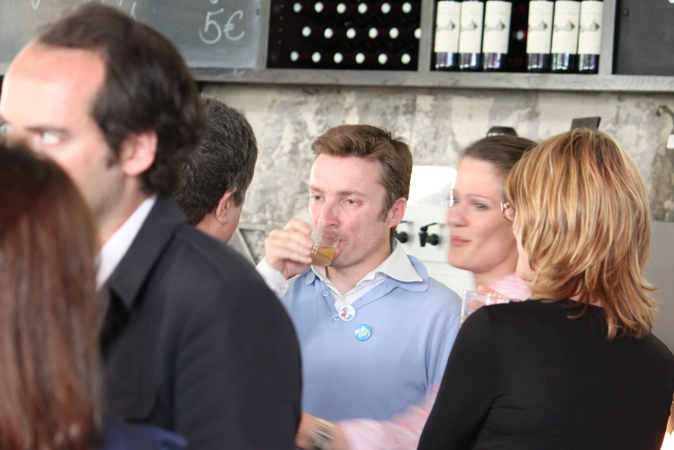 people are sitting and standing at an event