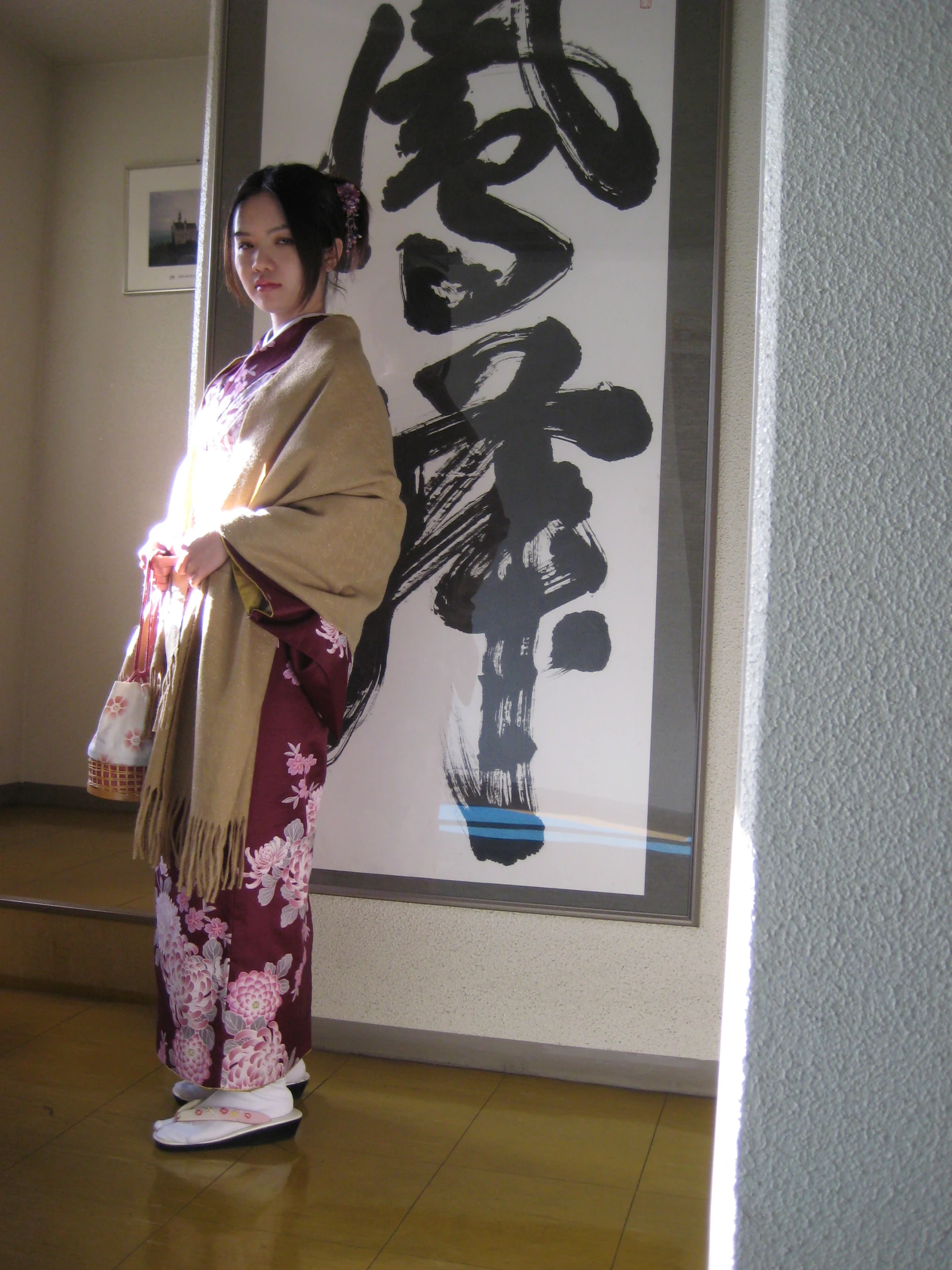 a woman is standing in front of an asian poster