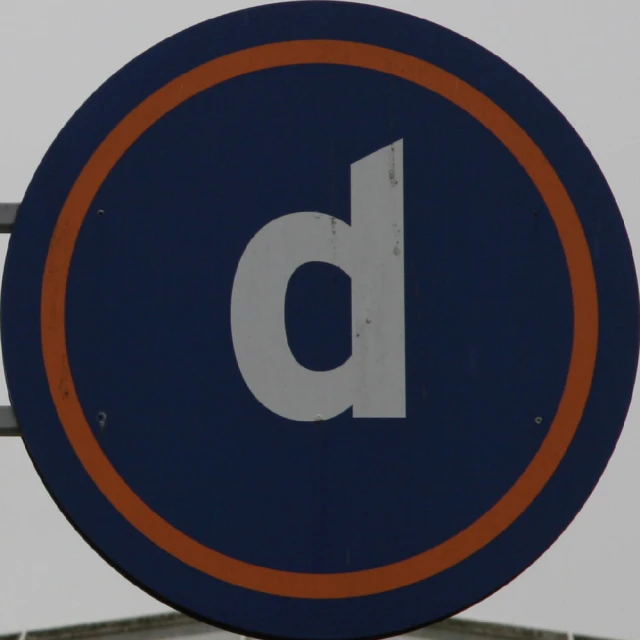 this is a very nice blue sign with an orange letter