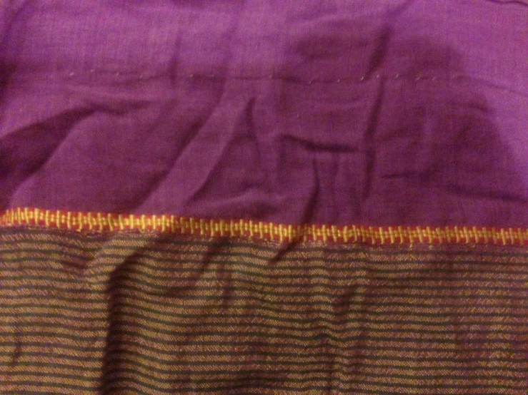 the stitch on this purple blanket has different colors