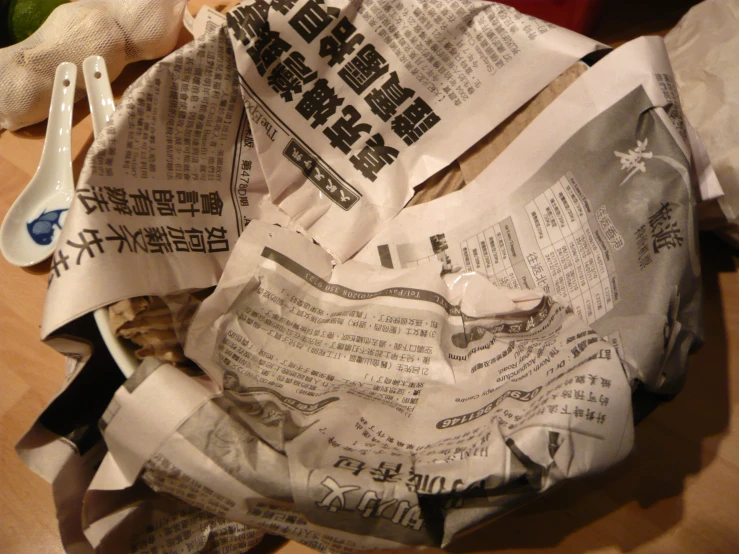 a dish full of lots of papers sitting on a table