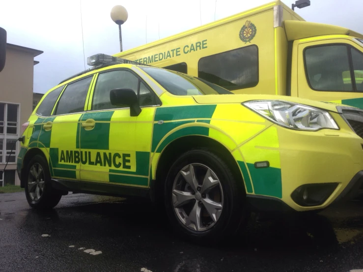 the ambulance car is painted yellow and green