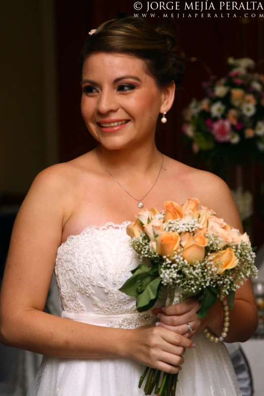 a woman in a white dress is holding a flower