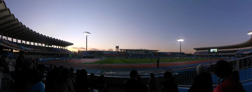 a football stadium with many people looking on