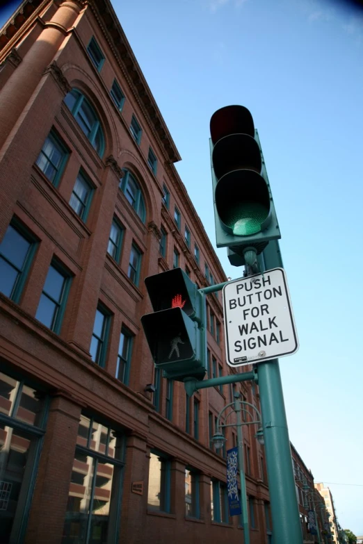 the traffic lights are red and green for pedestrians