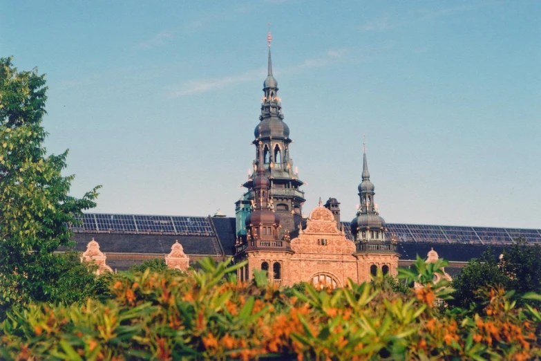 an old building with domes and spires in the background