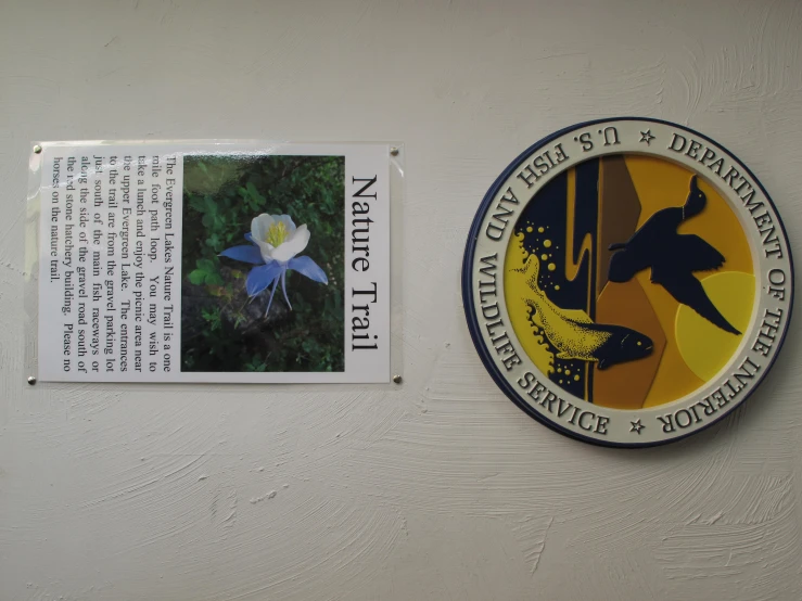 the plaque on the wall reads nature trail