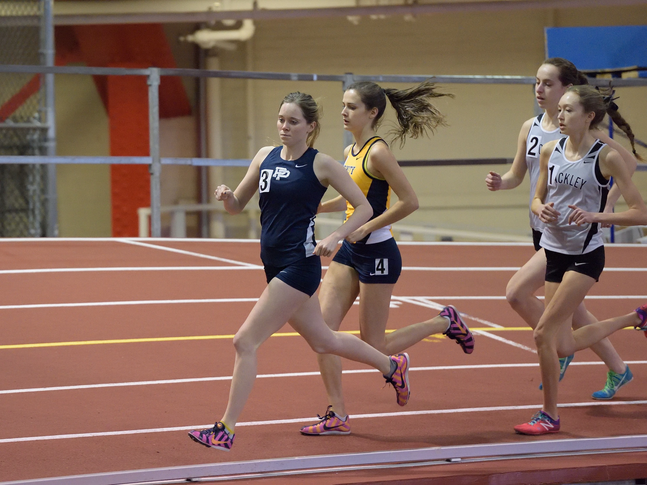 two women in a track running side by side