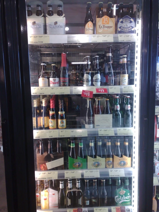 two display cases in a liquor store filled with bottles