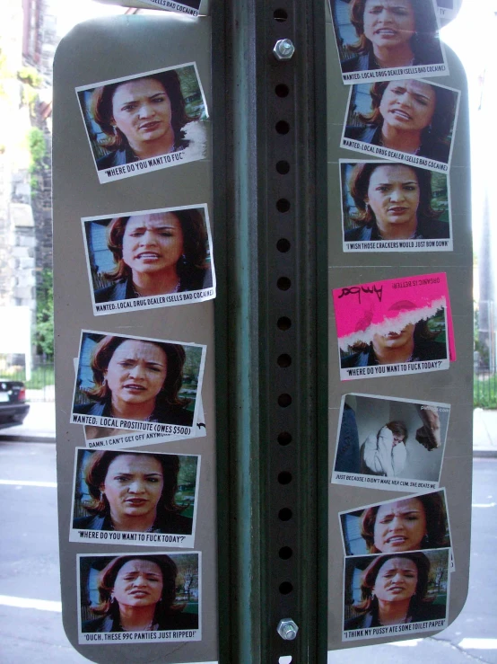 an advertit is posted on the side of a pole