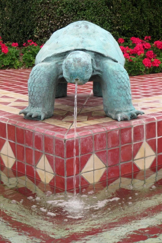 a statue of an ornate tortoise water fountain