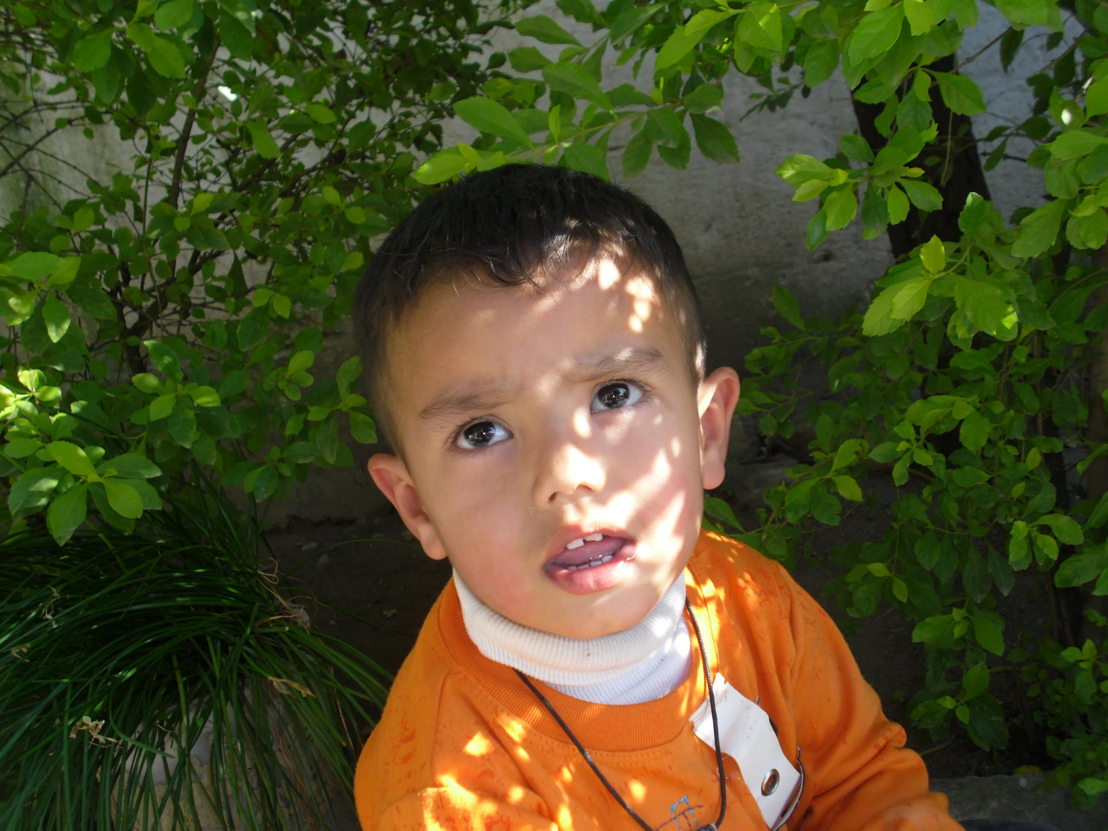 a boy with a surprised look in his face