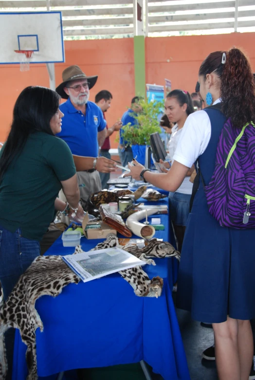 several people are at a table with some food on it