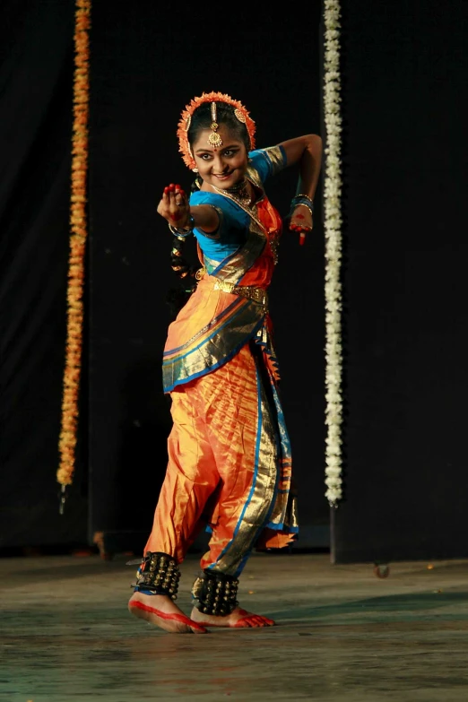 woman performing a dance on stage in front of spectators