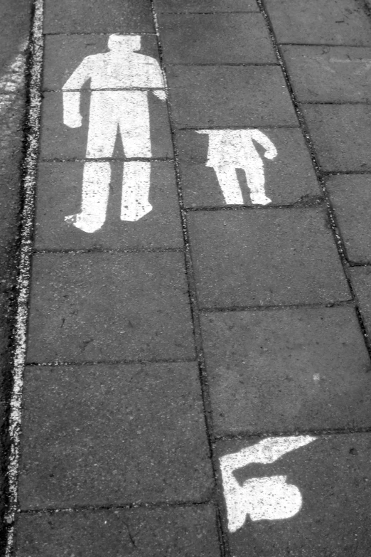 one man and one woman painted on the ground