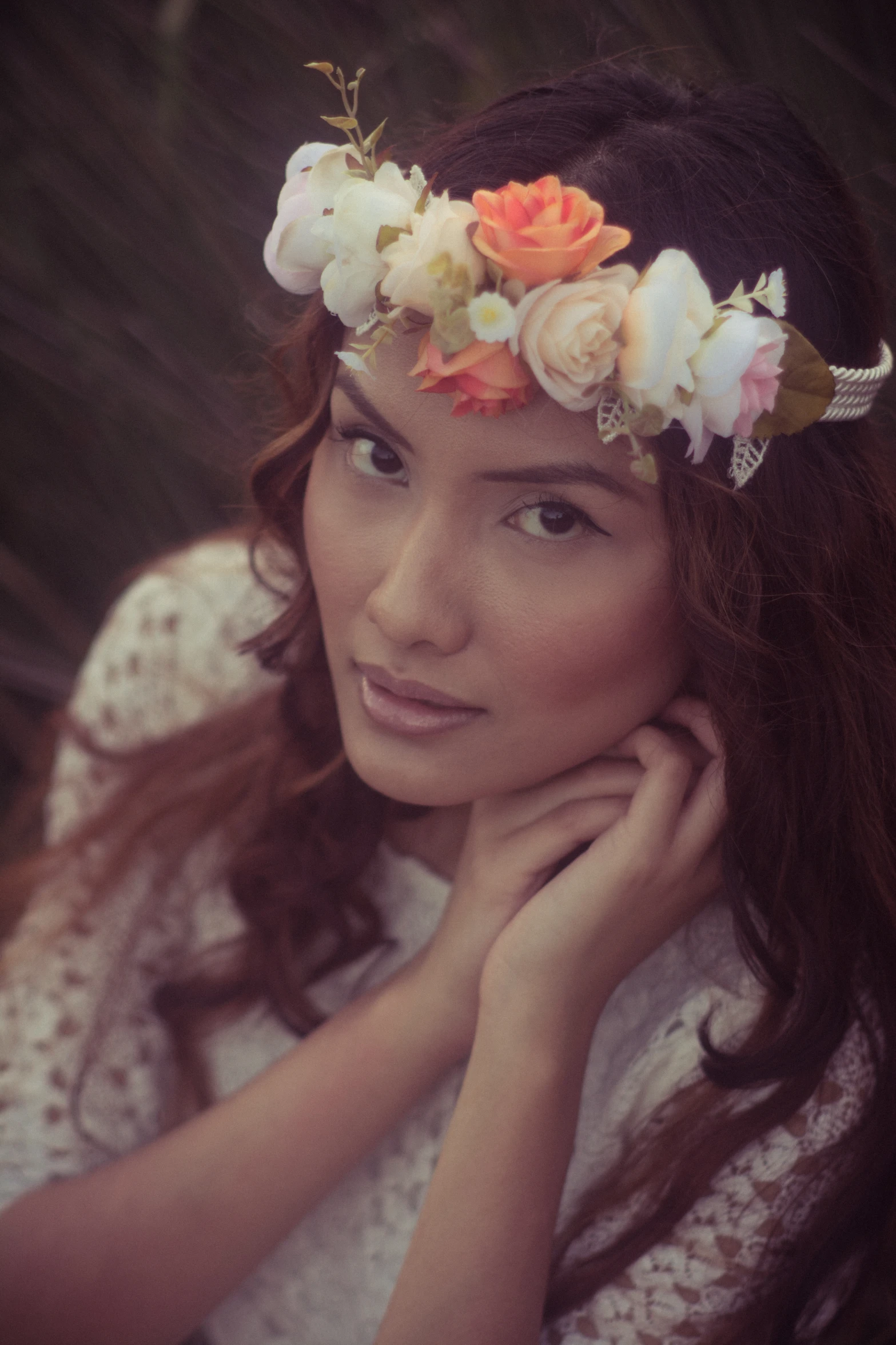 a girl with a flower crown in a lace top and dress