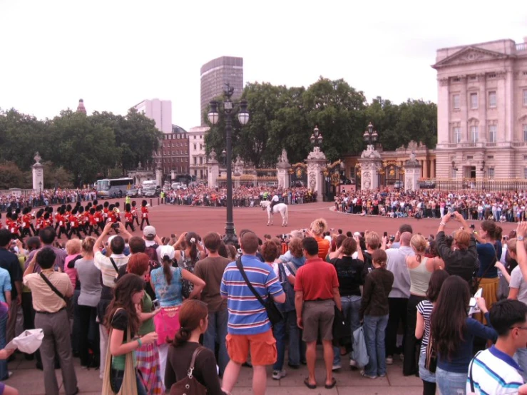a large crowd in the middle of a street