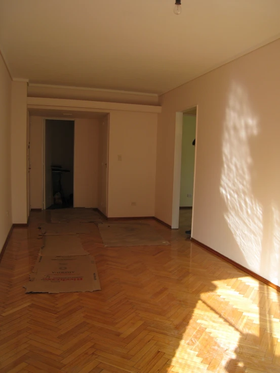 the interior of a bedroom showing parquet flooring