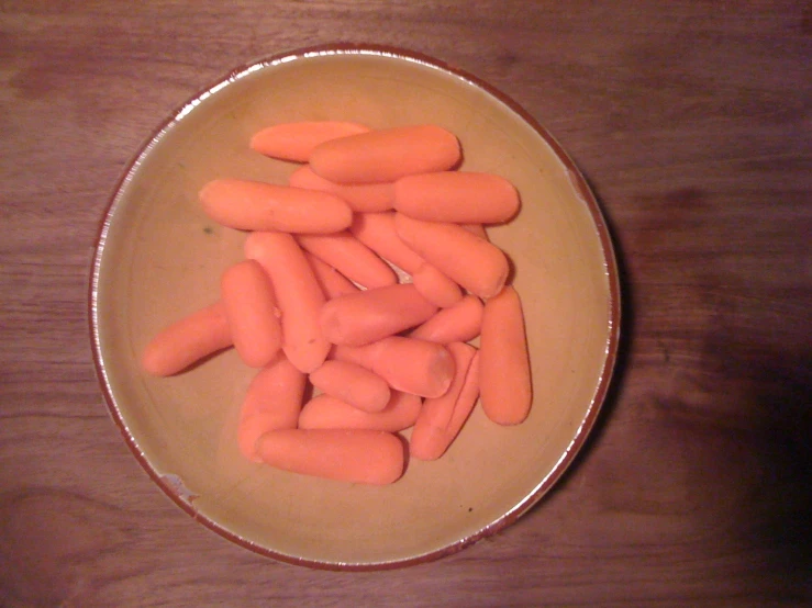 sliced up carrots in a bowl on a table