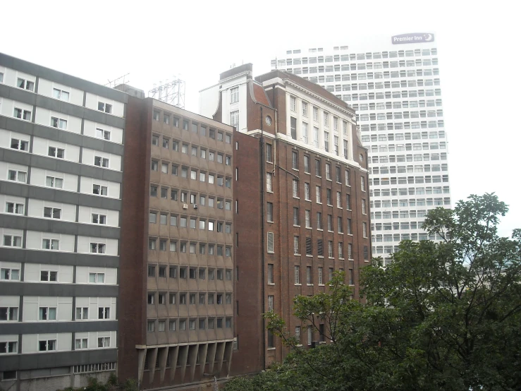 an overcast day shows buildings and trees