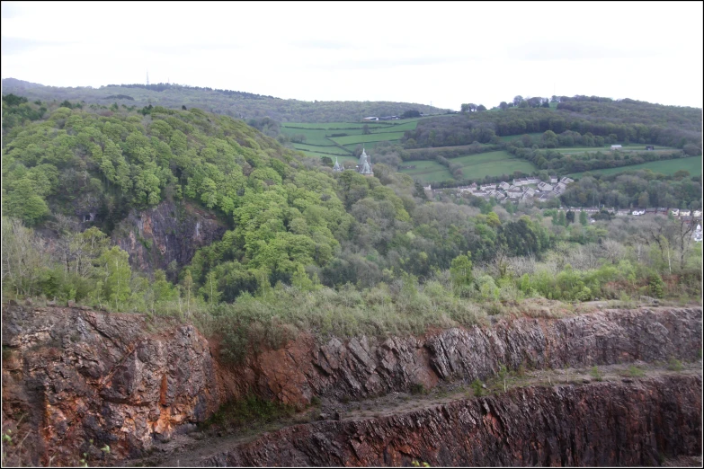 a valley that has a small mountain in the background