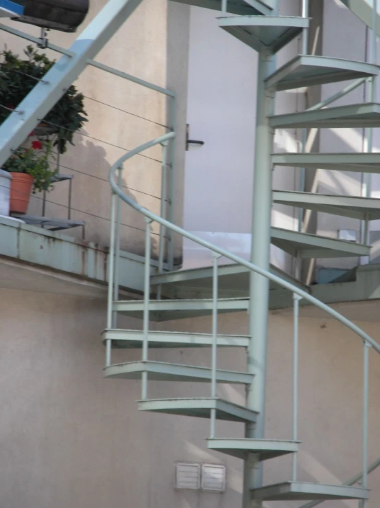 an open spiral staircase at a building