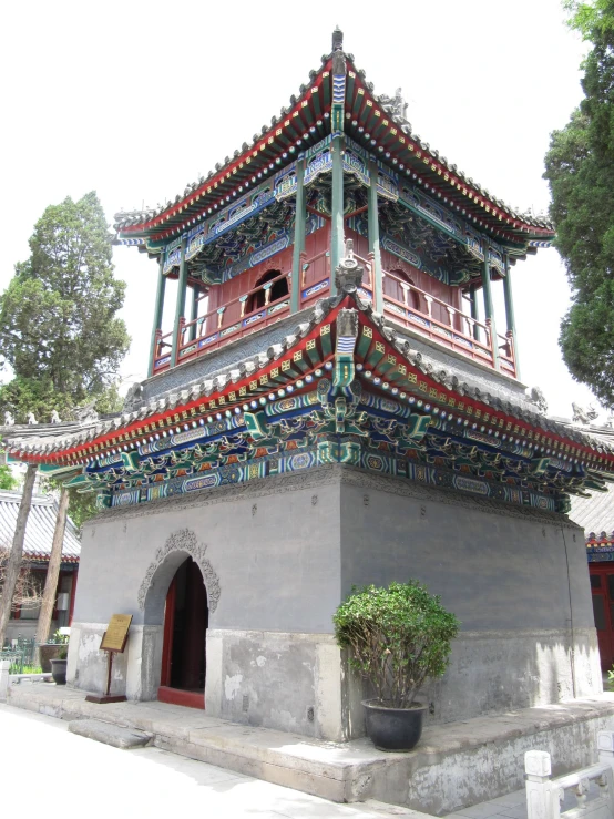 the bell tower is surrounded by colorful decorations