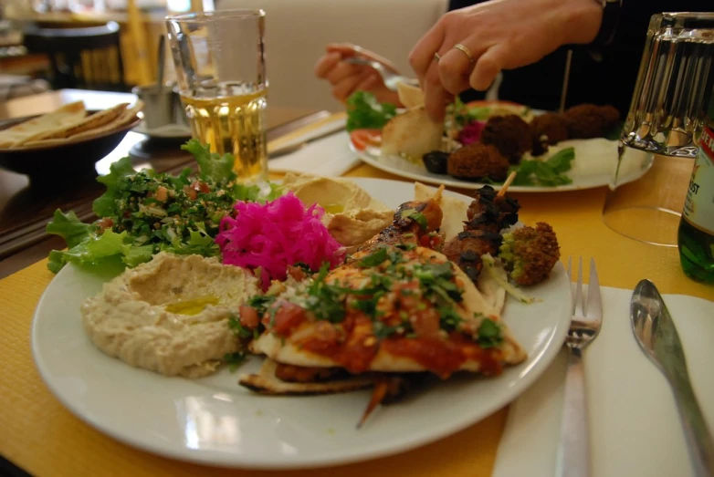 a plate of food being served at a restaurant