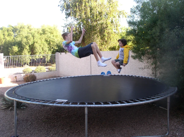 a child is jumping on top of a trampoline