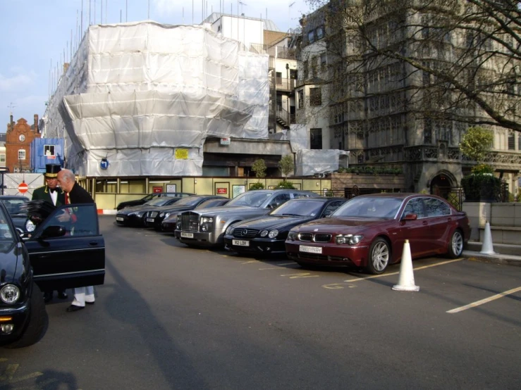 several cars parked in front of a construction site