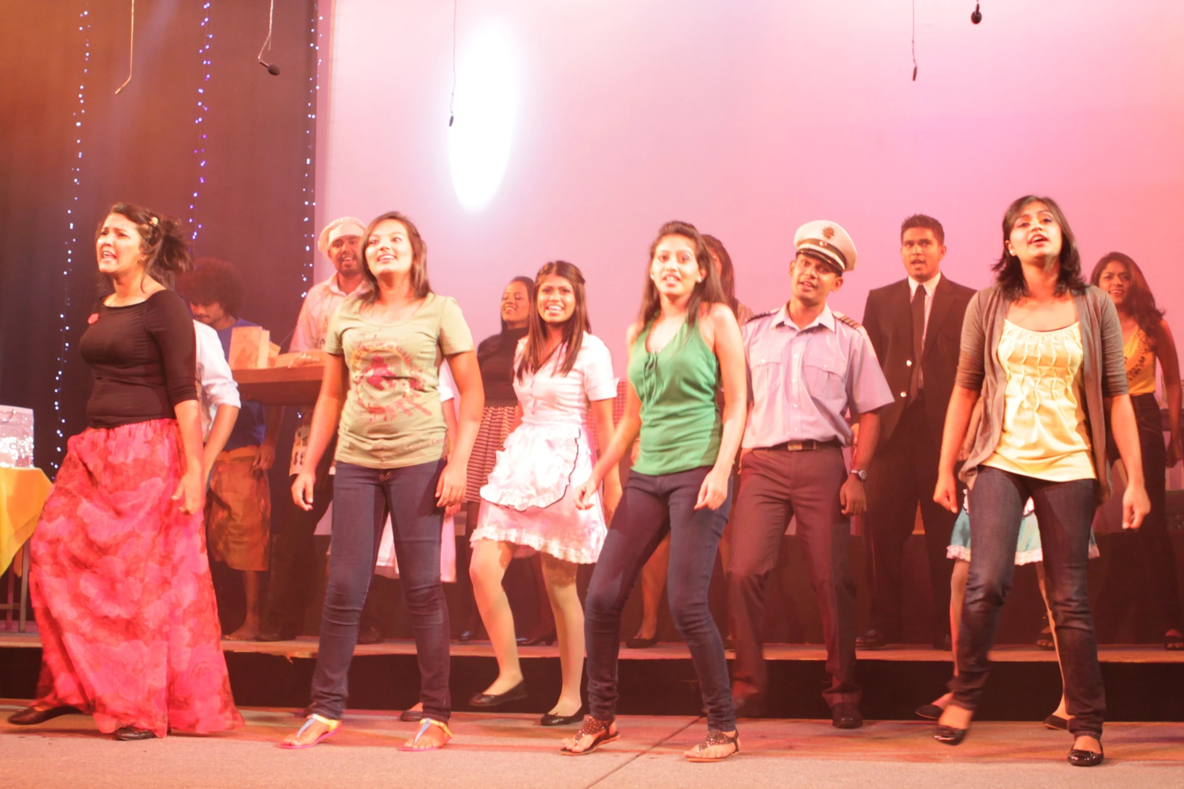 a group of young people standing on a stage