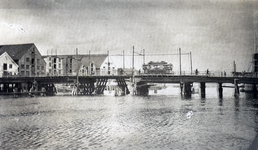 an old po shows people on a boat near the shore