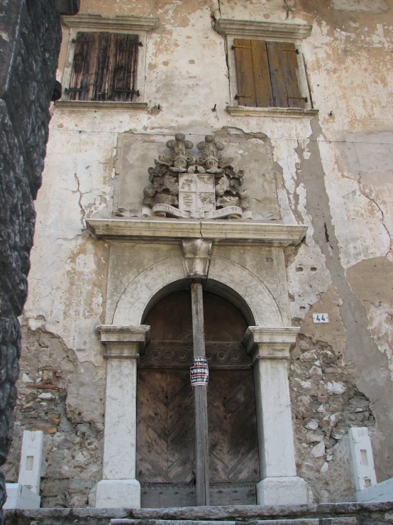 the doorway to an old brick and stone building