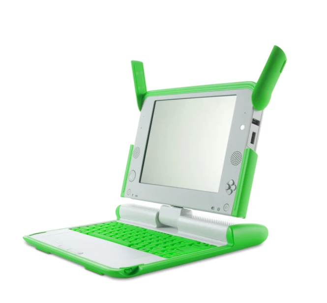 an open laptop computer that has two green sticks on the top of it