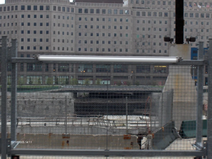 a view of the city skyline from behind a gate