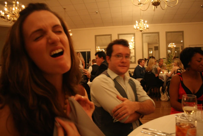 the two people are having fun together at the reception