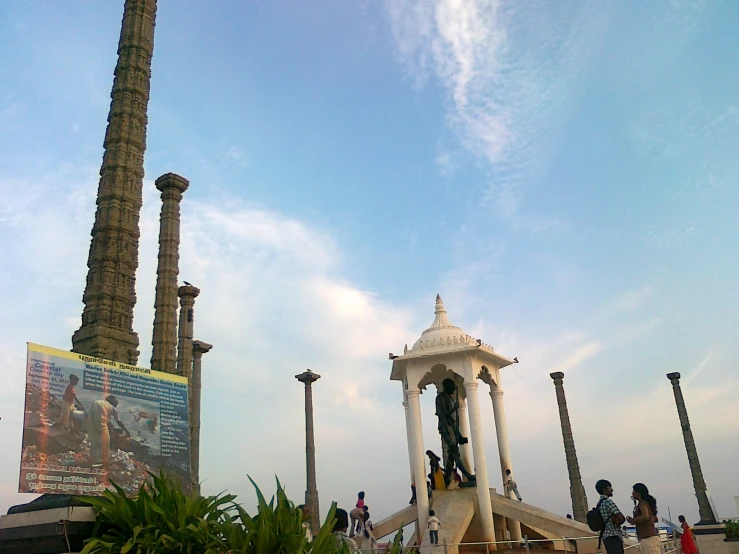 a couple of statues and some palm trees