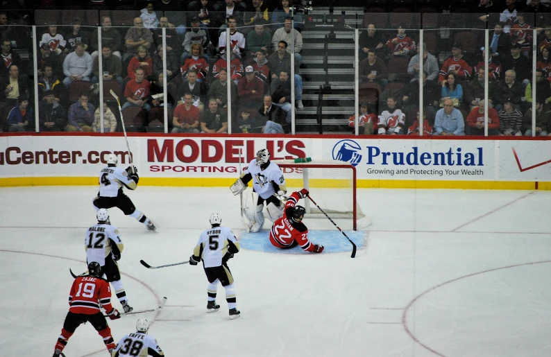 players in a hockey game during the night