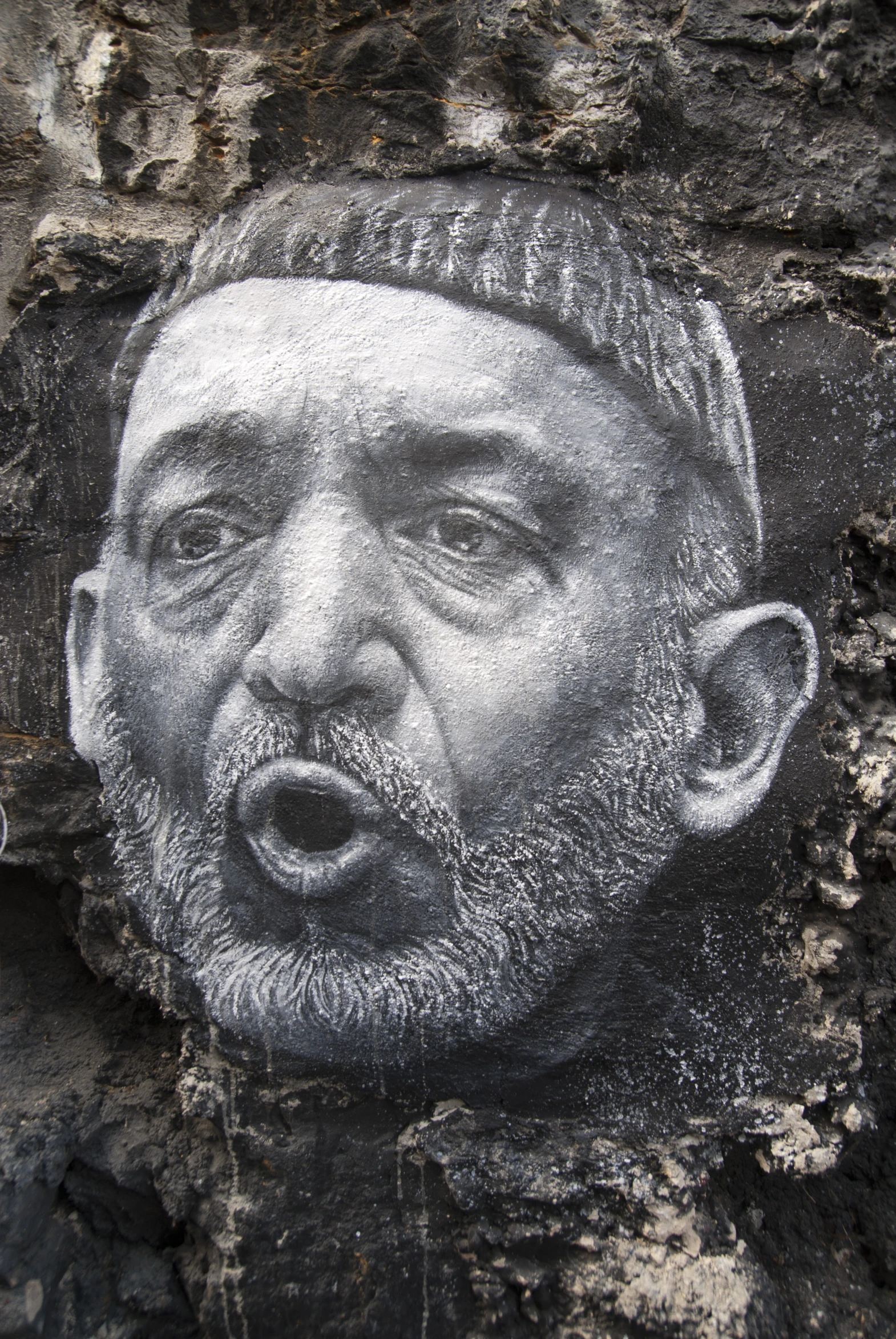 a chalk drawing of a man that has his mouth open