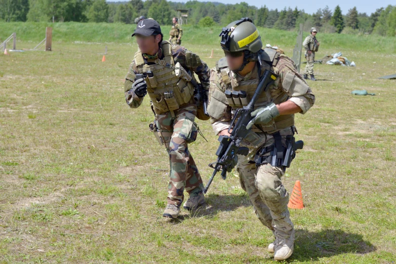 two soldiers are preparing to enter the ground