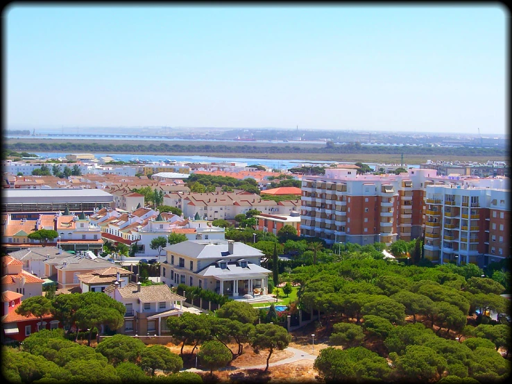 a city with lots of different colored buildings and trees